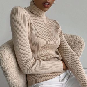 Women’s solid color knit turtleneck pullover sweater designed for warm and cozy casual winter wear